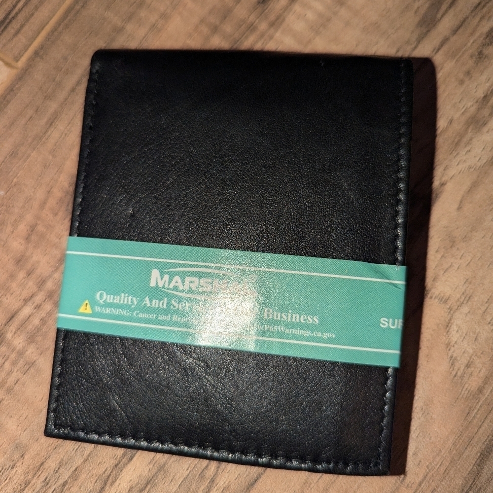NWT. Black Marshal bi fold wallet with lots of storage.